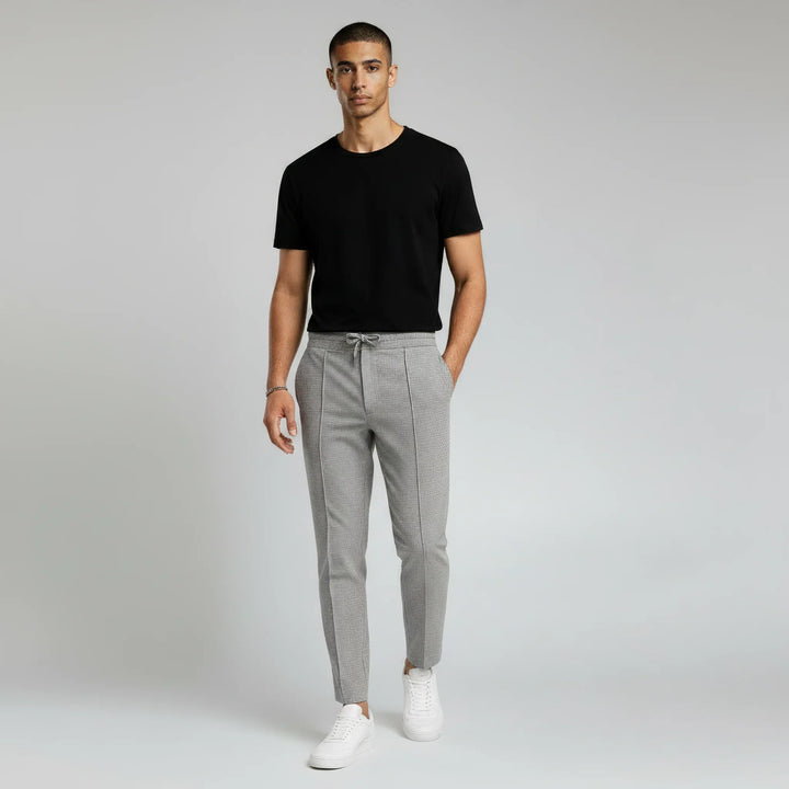 Men's slim fit textured casual trousers. Modern drawstring pants, ideal for smart-casual outfits.