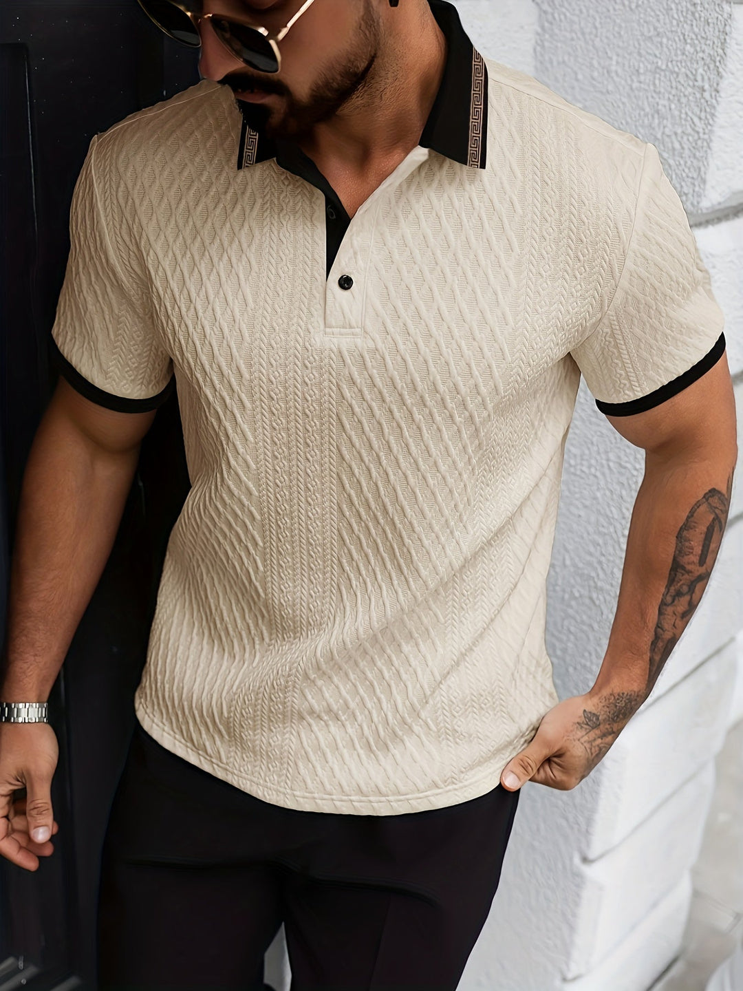 Front view of a men's short sleeve textured polo top, a versatile smart casual piece.