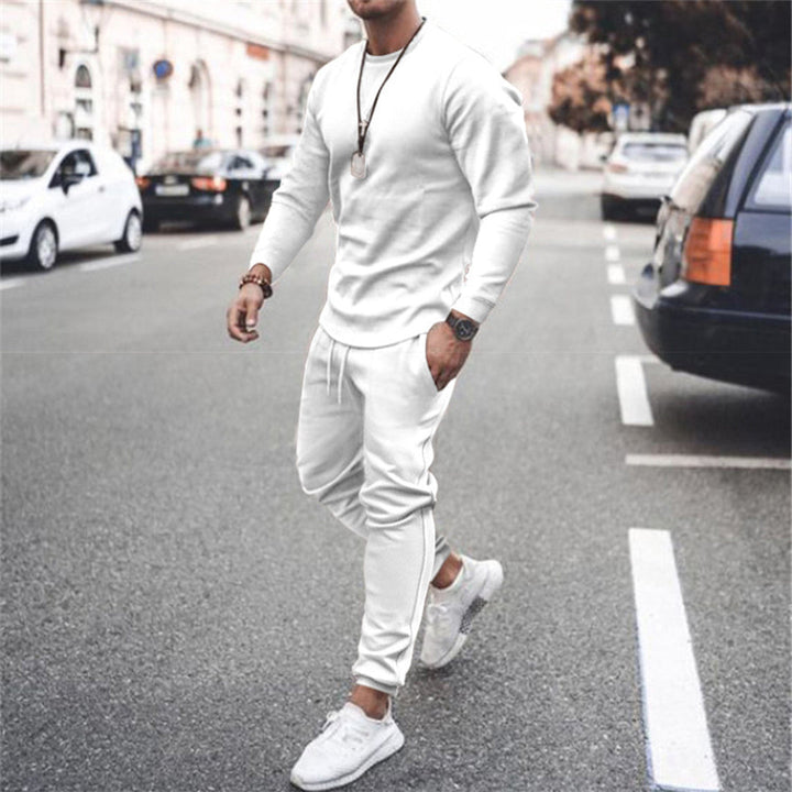 Man jogging in a stylish slim fit tracksuit, perfect comfortable sportswear for athletic and casual activities.