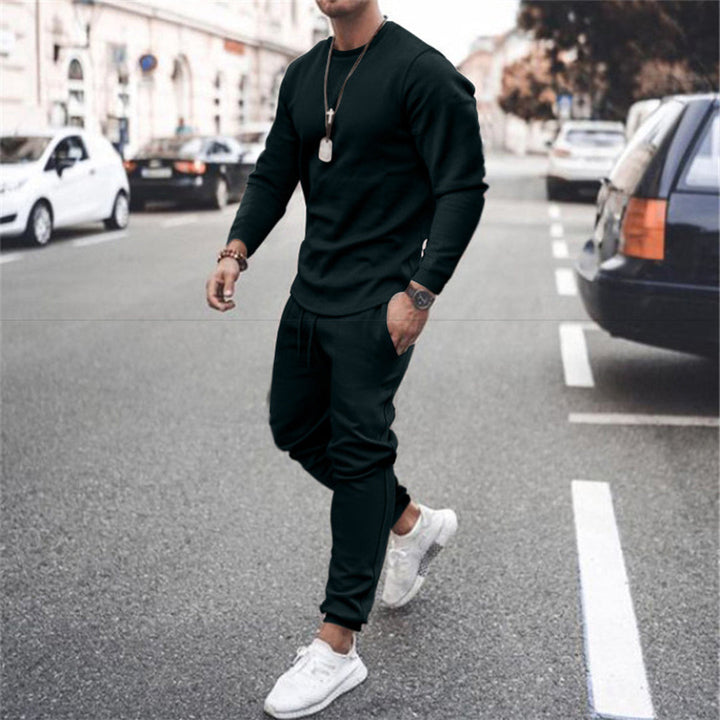 Black men's slim fit tracksuit, a comfortable sports jogging set designed for athletic performance & casual style.