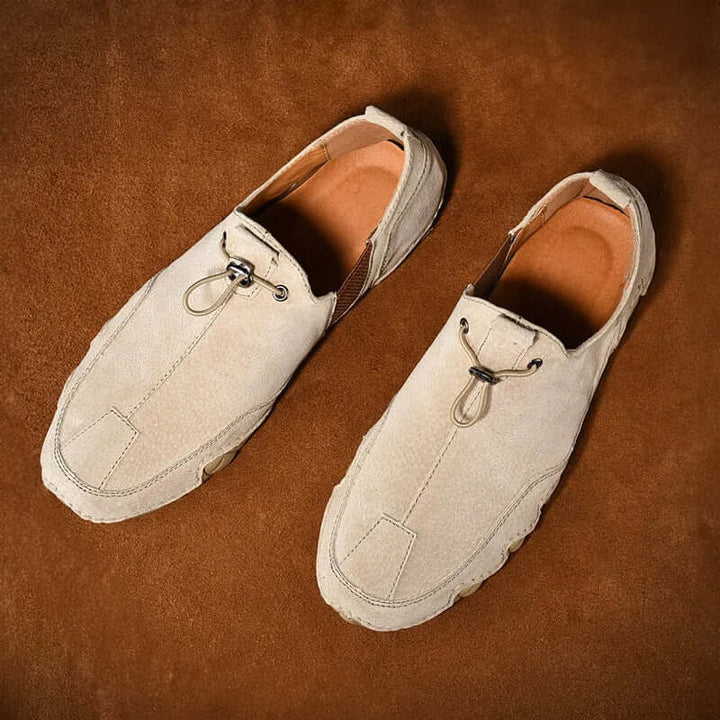 Stylish men's brown slip-on driving loafers, round toe, flat heel, ideal comfortable casual shoes for men.