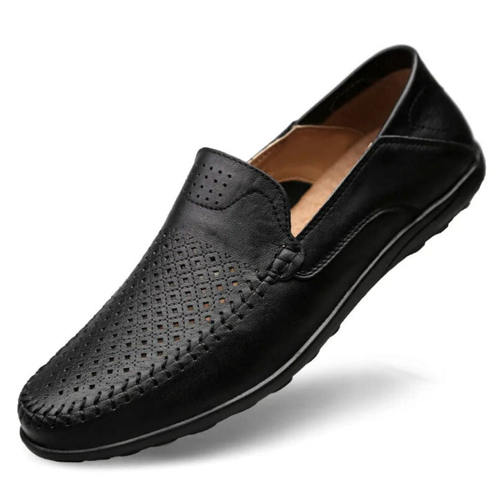 Men's slip-on loafers with perforated design & stitched panels, perfect for casual summer wear. Comfortable men's shoes.