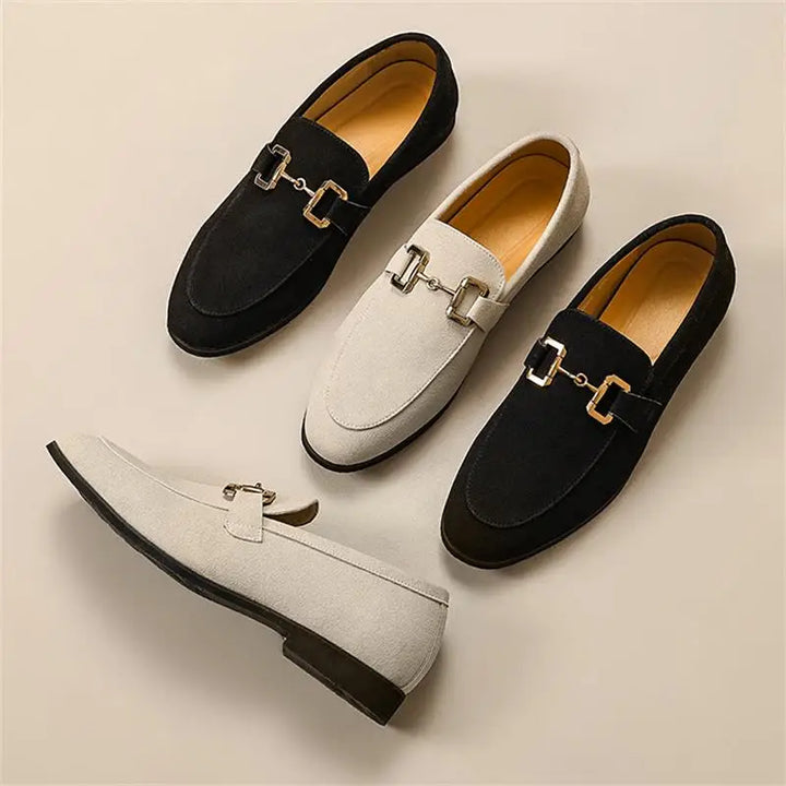 Black slip-on loafers for men, accented with a polished metal detail