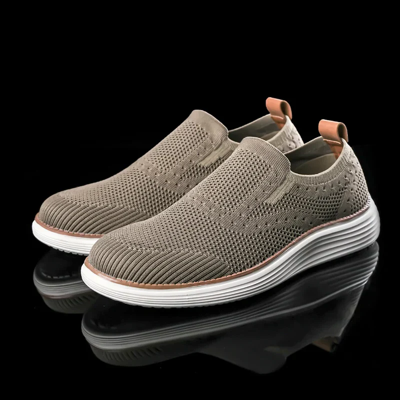 Men's slip-on summer trainers, lightweight & breathable, perfect for casual wear & travel comfort.