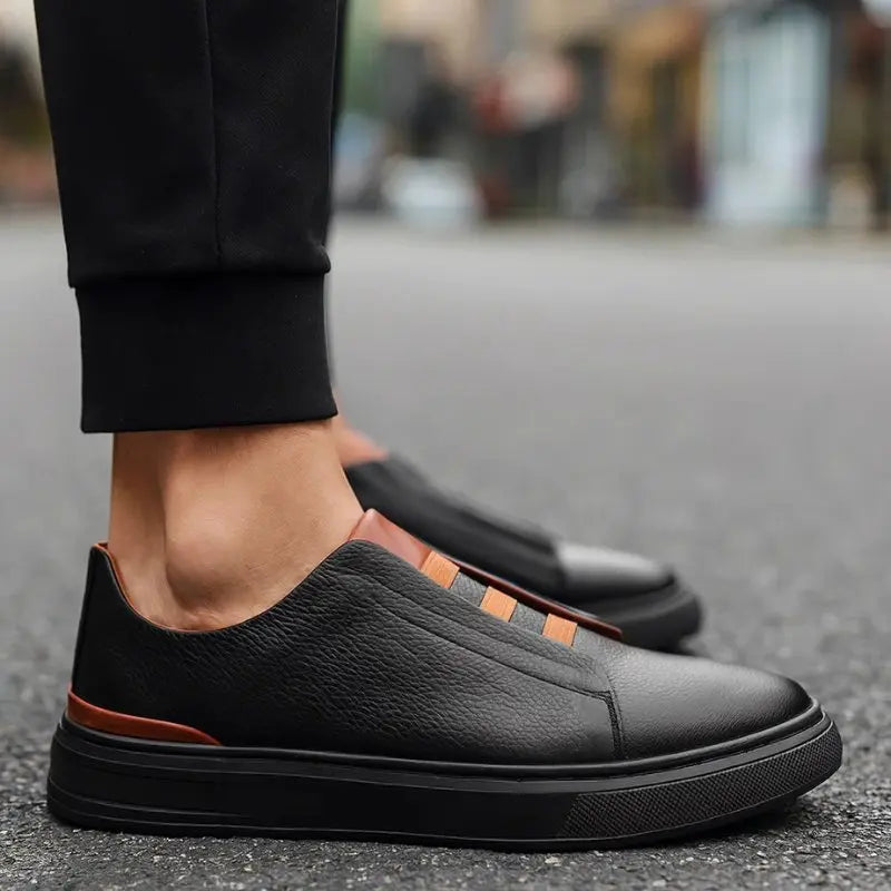 Comfortable men's athletic slip-on trainers; modern footwear for casual outings with secure loop lacing.