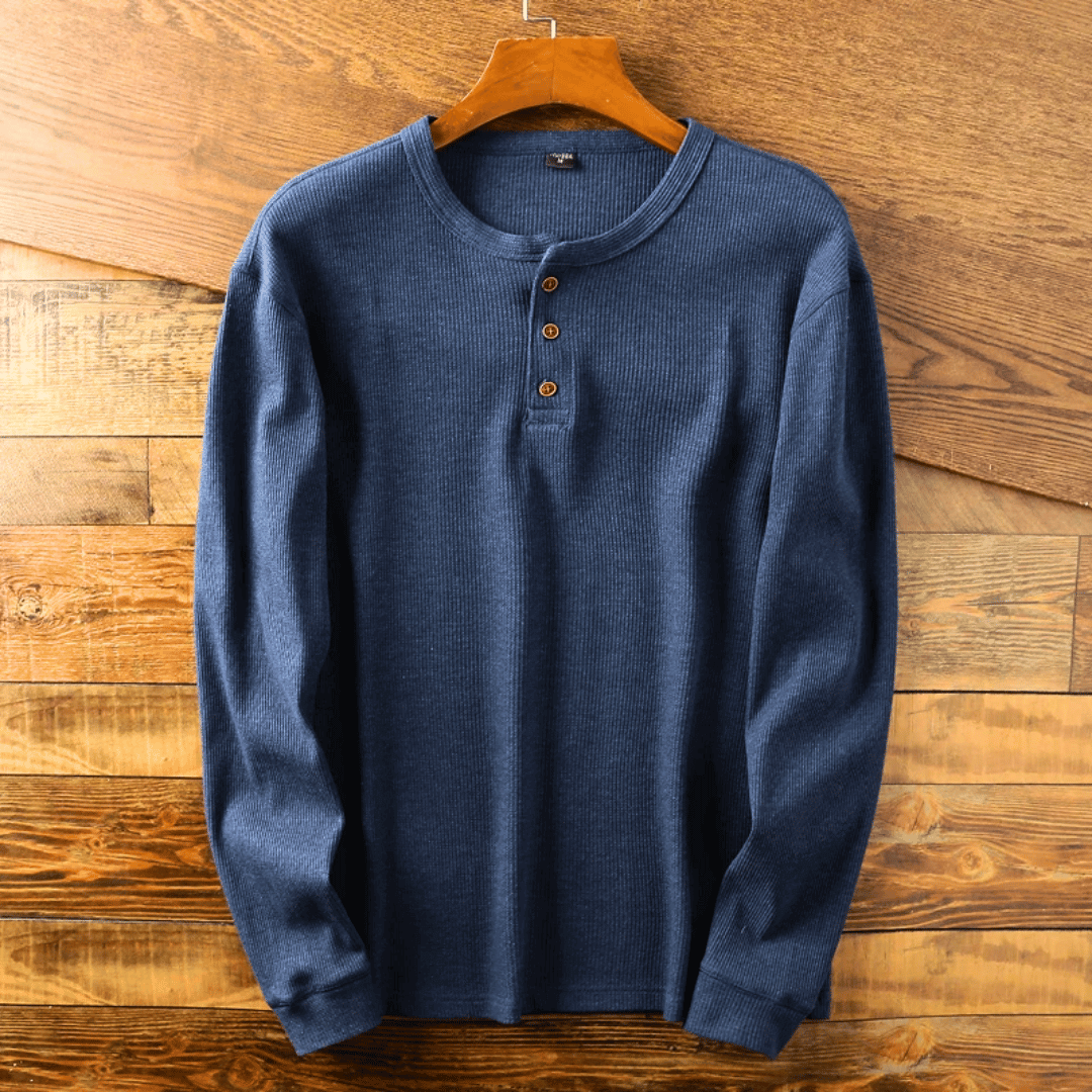 Close-up of a soft men's Henley shirt with detailed button-up neckline. Everyday casual top.