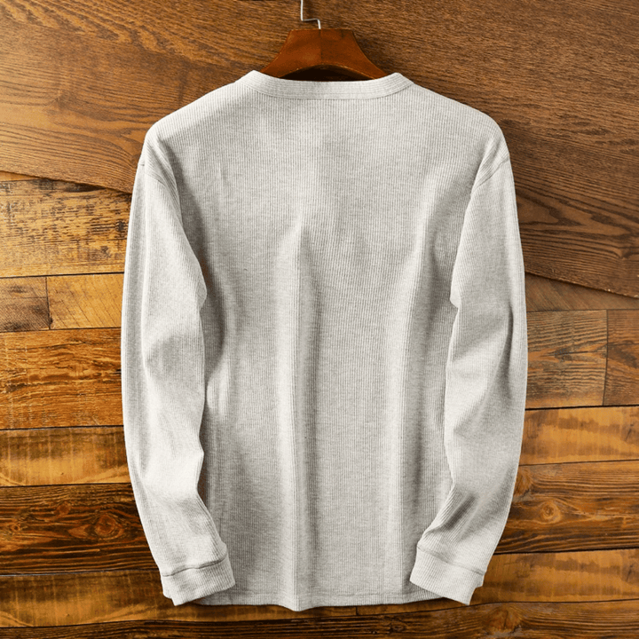 Versatile men's button Henley shirt in a soft, breathable fabric. Perfect for everyday casual wear.