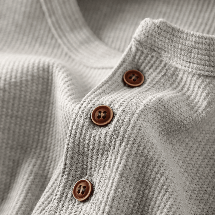 Men's casual long sleeve shirt, a soft Henley design with a buttoned placket. Essential comfortable top.