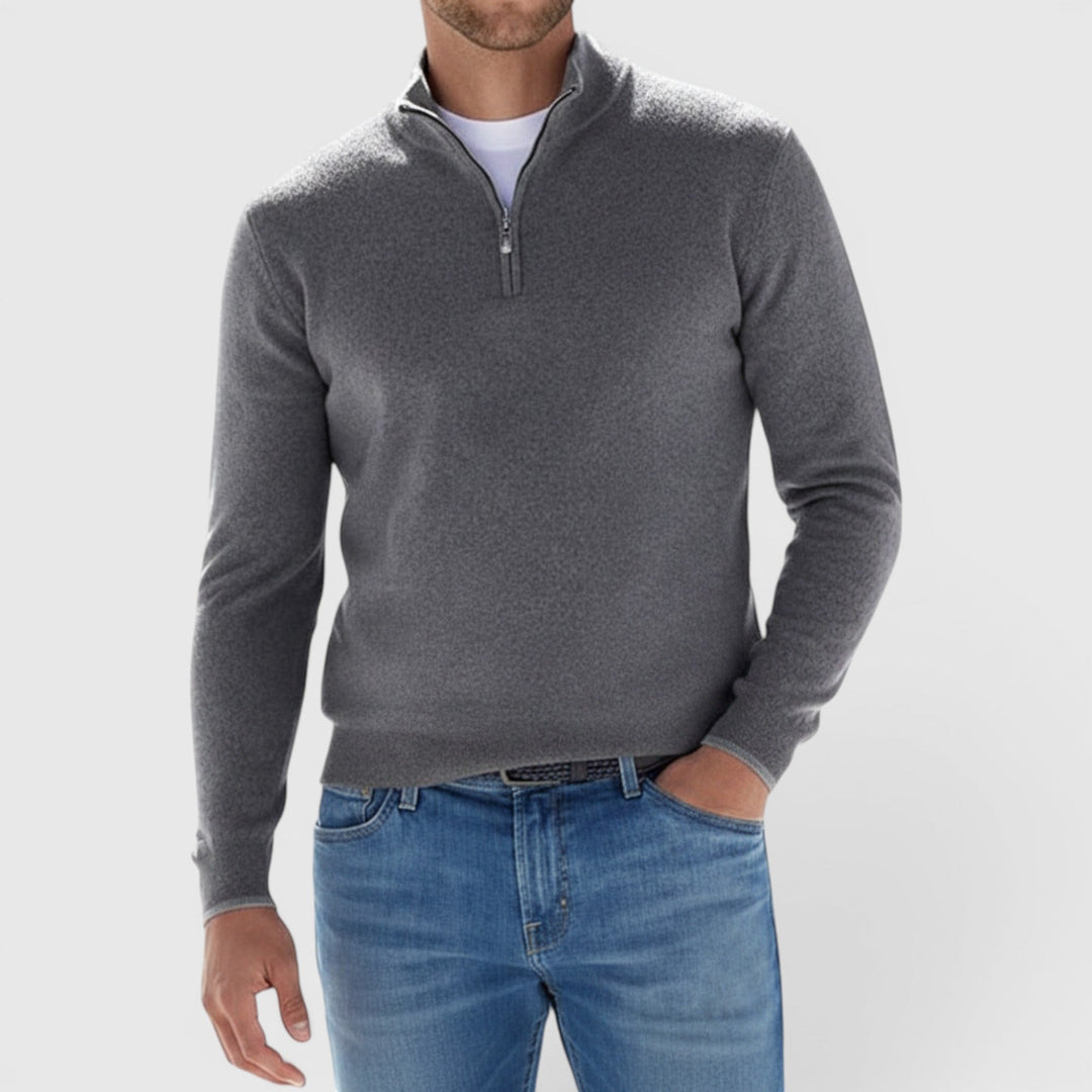 Close-up of a comfortable men's soft quarter-zip polo sweater, highlighting fabric & smart casual design.