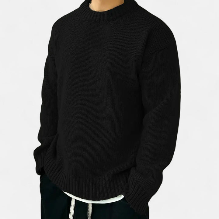 Experience comfort in this men's solid crew neck sweater, a must-have.
