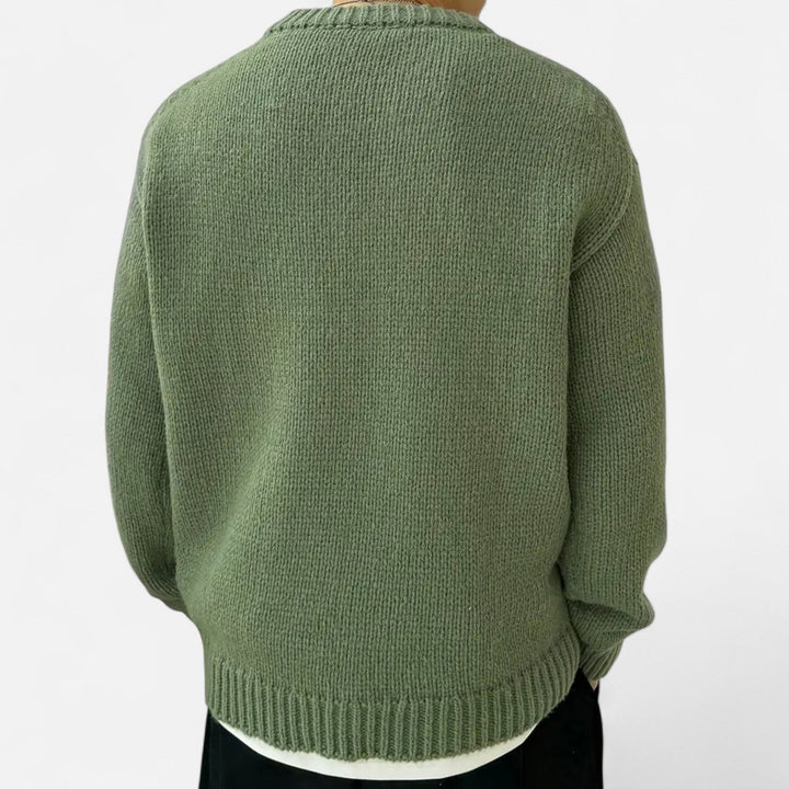 Men's solid knit sweater, featuring a crew neck and long sleeves.