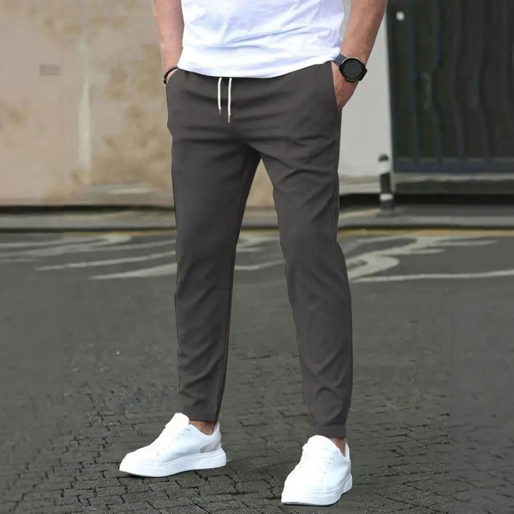 New men's polyester athletic joggers, perfect for workouts or casual everyday comfort. Features pockets.