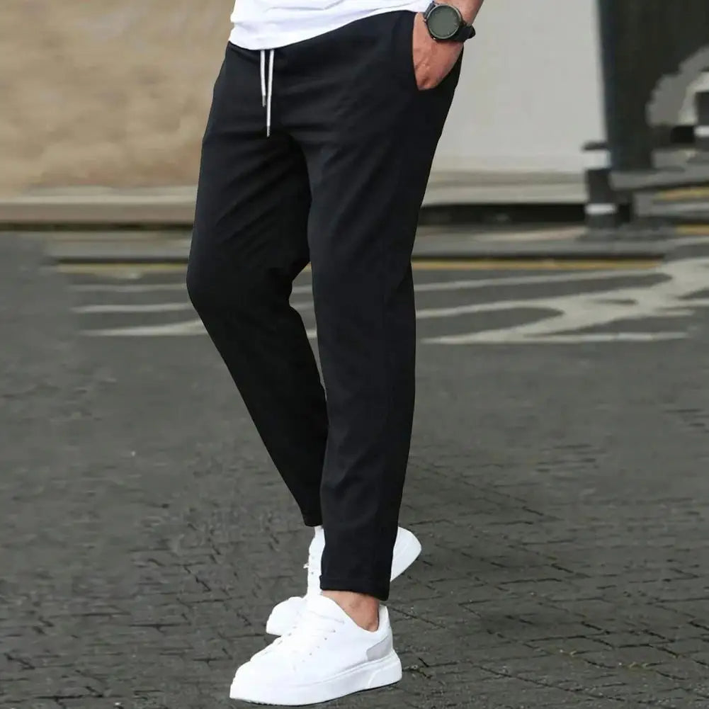 Comfortable men's activewear joggers. Sporty design with an elastic waistband & side pockets for fashion & function.