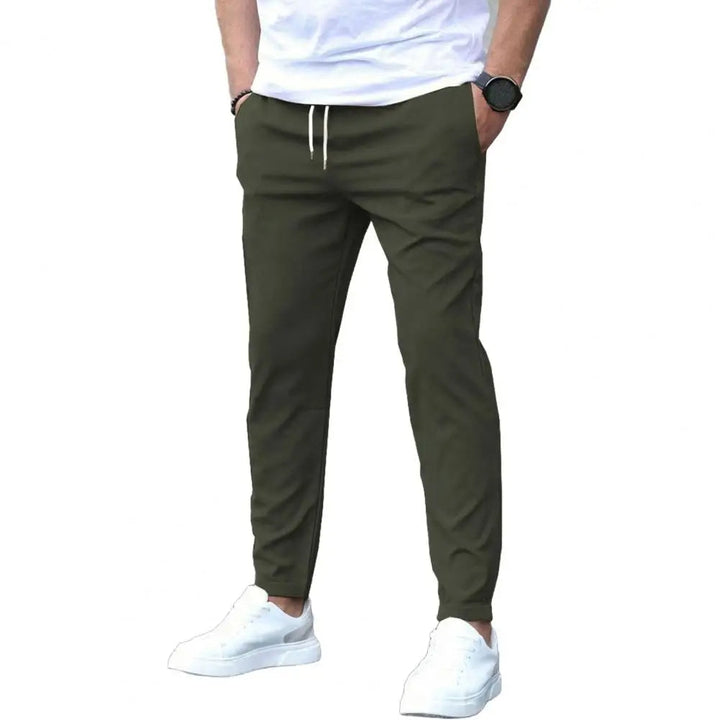 Casual men's sporty joggers. Versatile polyester pants with an elastic waist & pockets for everyday wear or workouts.
