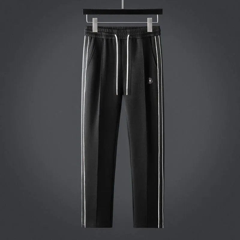 Soft men's two-piece tracksuit set: zip-up jacket & joggers. Stylish activewear and loungewear for ultimate comfort.
