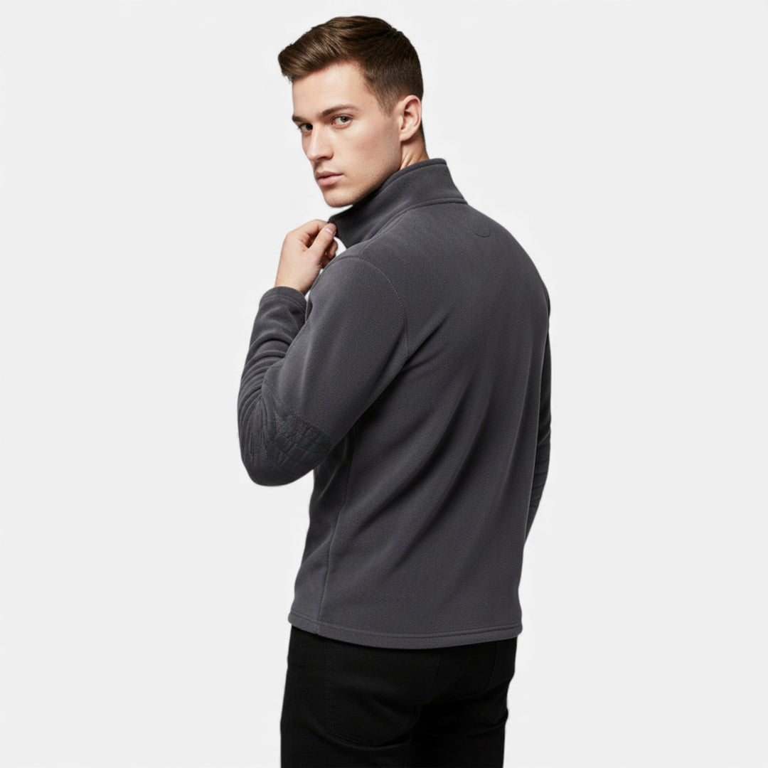 Model wearing a blue men's stand-collar fleece pullover for casual wear
