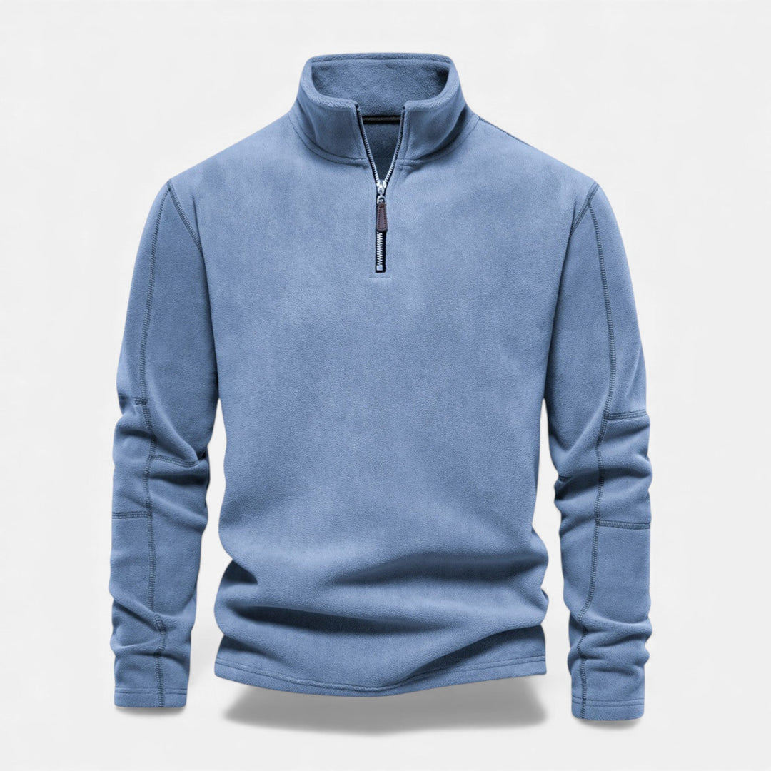 Styling a men's zippered sweatshirt with jeans for a winter look