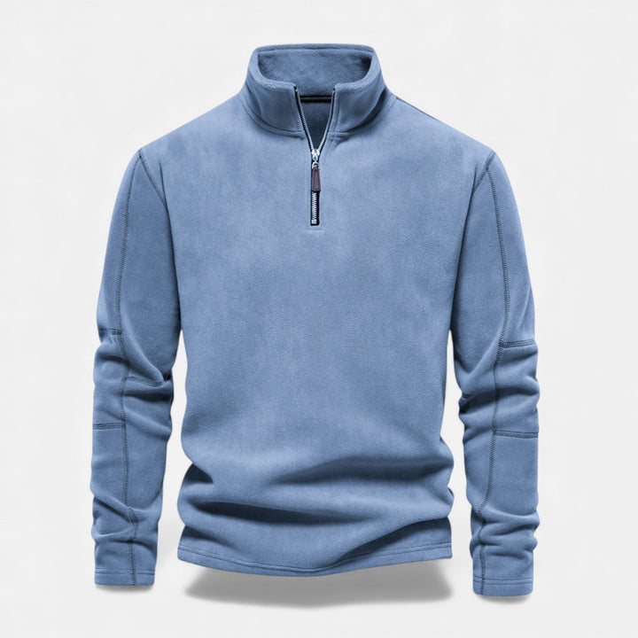 Styling a men's zippered sweatshirt with jeans for a winter look