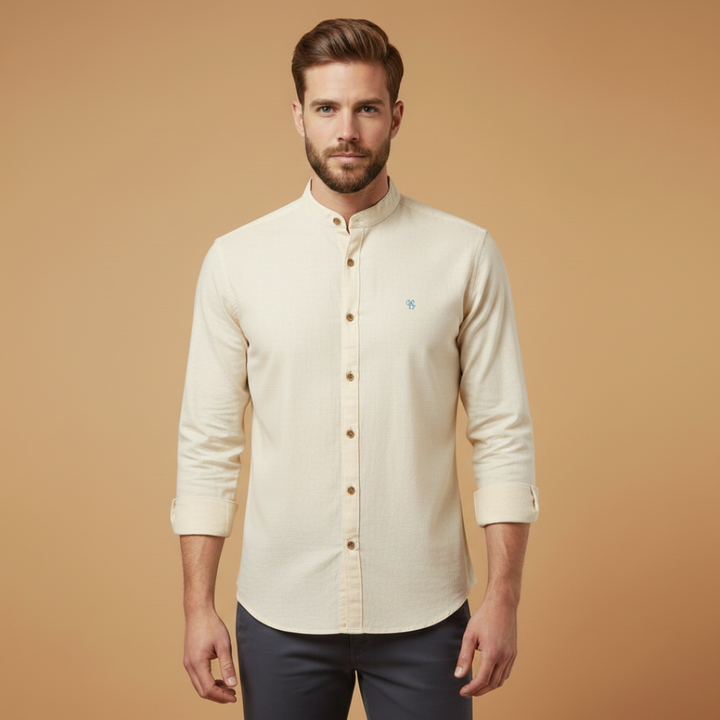 Detail shot of the fabric and stitching on a men's stand collar button-up shirt