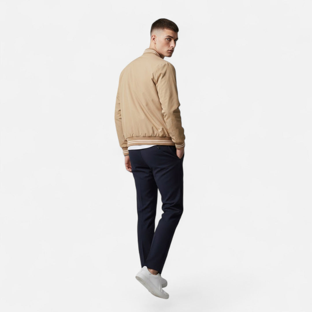 Pairing the men's casual jacket with jeans for a stylish look.