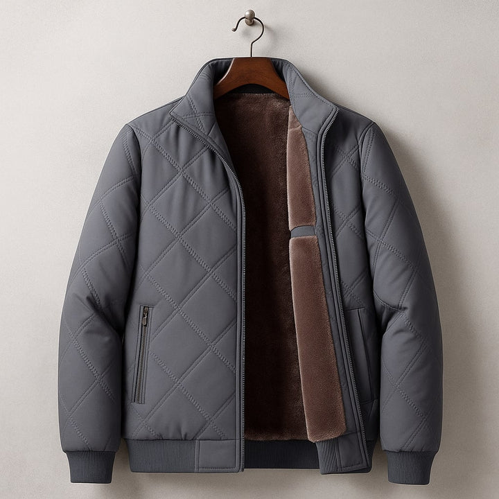 Classic men's quilted bomber jacket featuring a stand collar. Versatile casual outerwear for fall and winter fashion.
