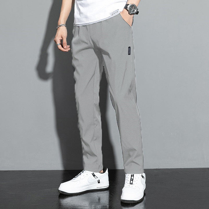 Comfortable men's straight leg pants featuring an elastic waist & convenient slash pockets; perfect relaxed fit.