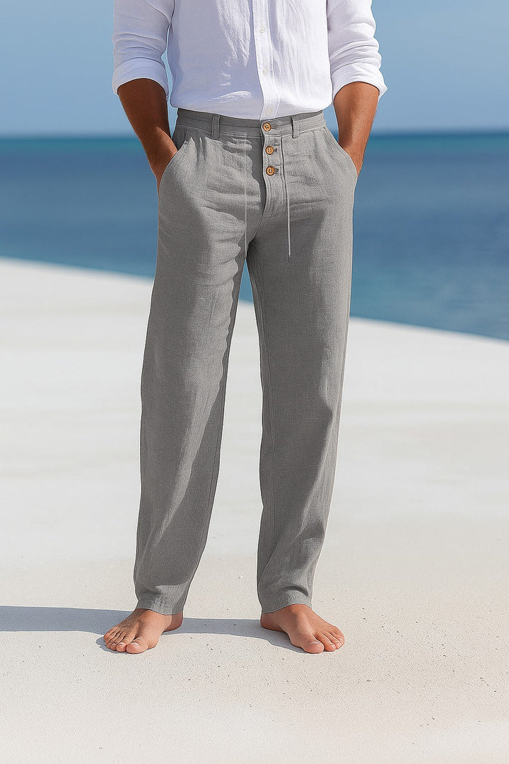 Model wearing men's straight leg linen trousers, showcasing comfortable fit & versatile summer style.