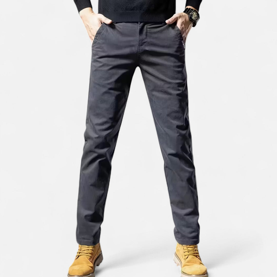 Model wearing grey men's straight-leg trousers, showcasing a formal wear look.