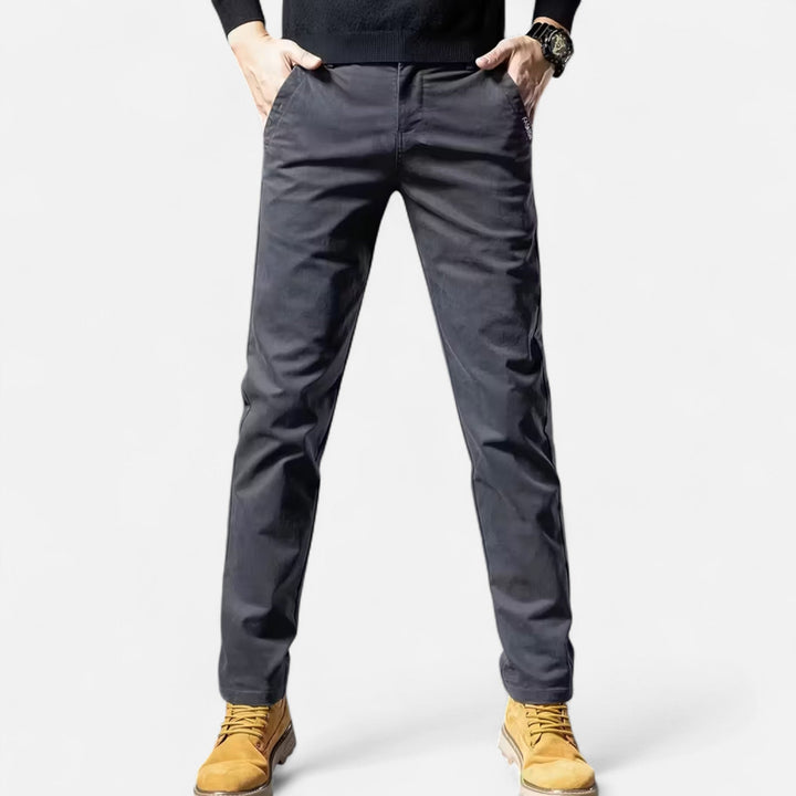 Model wearing grey men's straight-leg trousers, showcasing a formal wear look.