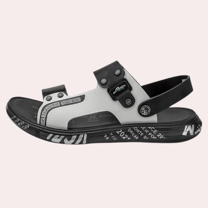 Stylish men's summer sandals featuring buckle straps and a cushioned sole, suitable for outdoor adventures and casual wear.