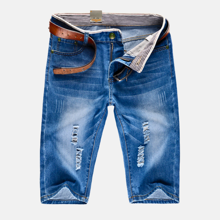 Men's streetwear distressed denim shorts with rips, ideal for urban casual summer fashion.