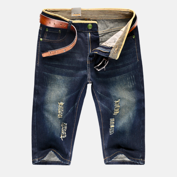 Relaxed fit men's denim shorts, distressed and ripped for a stylish streetwear look.