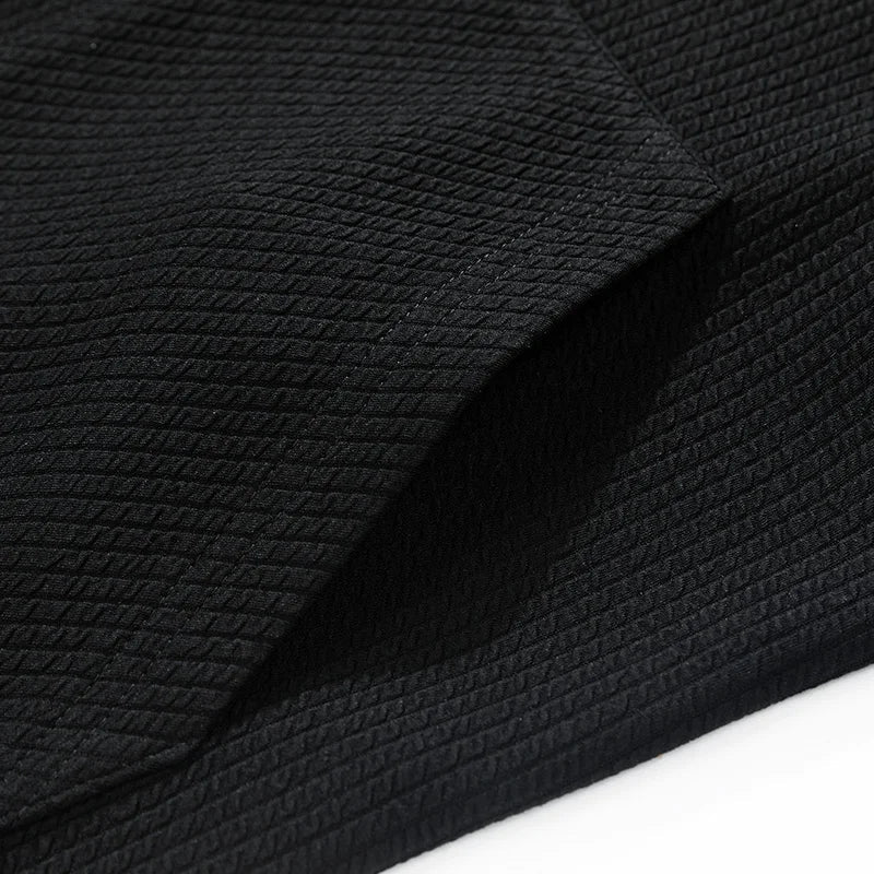 A cozy men's zip cardigan made from soft, stretchable knit material.