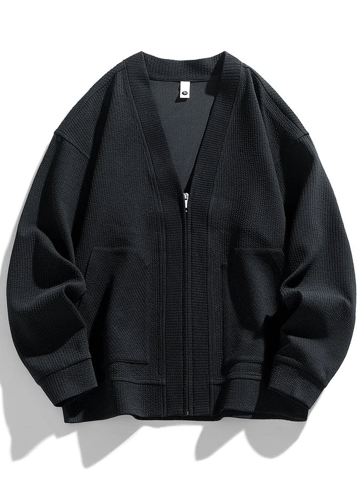 Front view of a men's stretch fit zip cardigan in a winter color.
