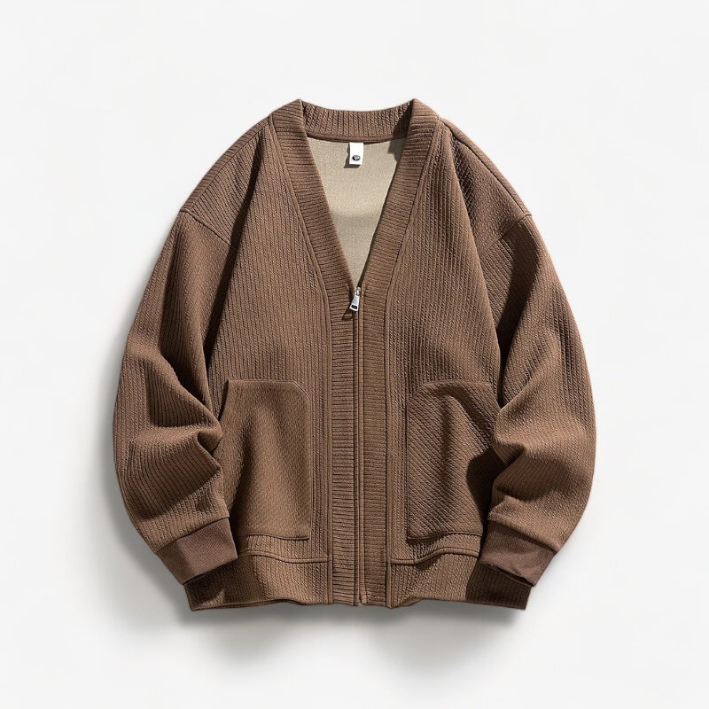 Detail of the zipper closure on a comfortable men's knit sweater.