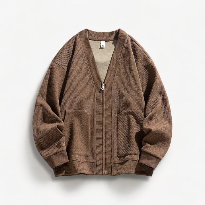 Detail of the zipper closure on a comfortable men's knit sweater.