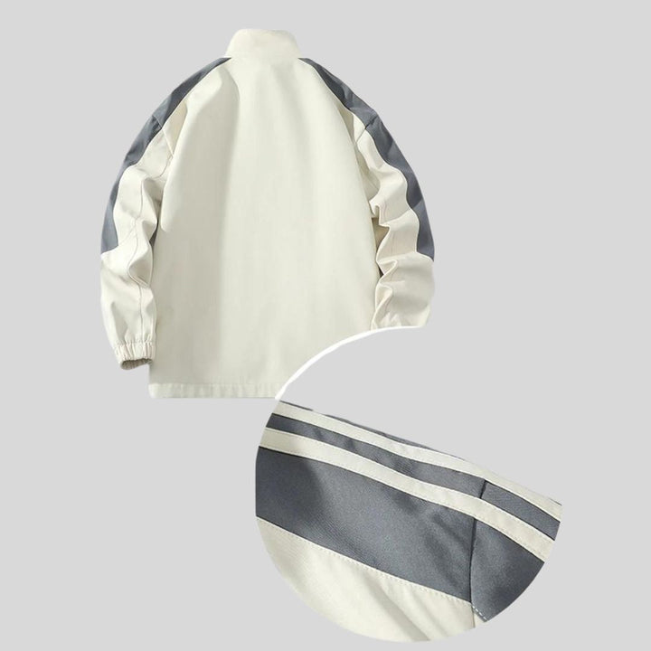 Complete men's striped tracksuit: stylish jacket & joggers, perfect for active comfort and sportswear.