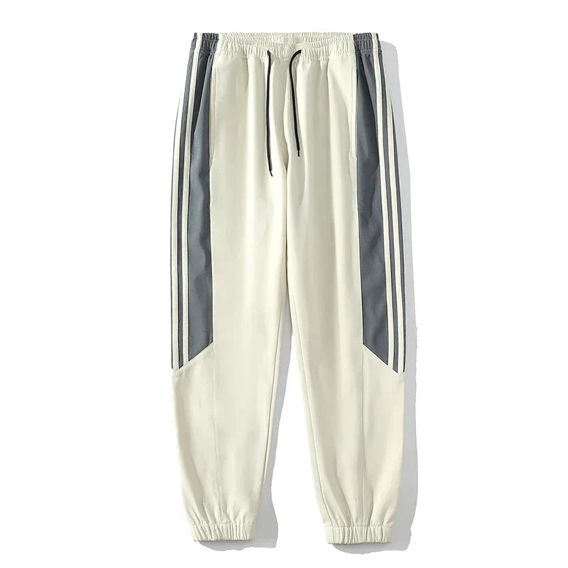 Effortless style men's striped tracksuit, perfect for active comfort. Includes jacket & joggers.