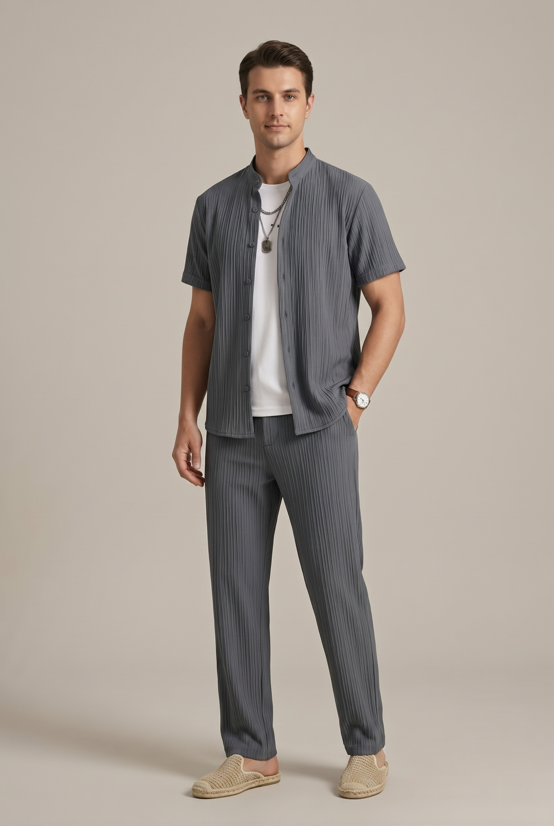 Detailed view of the men's striped shirt and trousers set, showcasing the fashionable pattern and comfortable fabric.