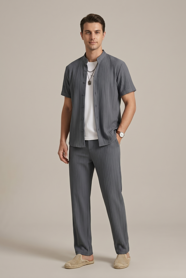 Detailed view of the men's striped shirt and trousers set, showcasing the fashionable pattern and comfortable fabric.