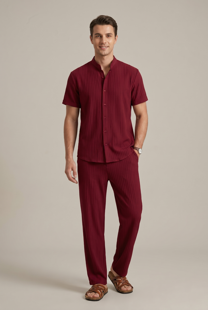 Contemporary men's striped outfit, a two-piece set comprising a stylish top and comfortable coordinated trousers.
