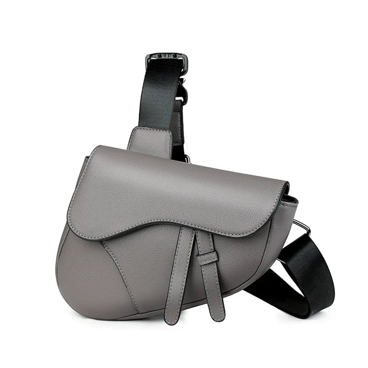 Modern men's structured saddle crossbody bag in matte black. Adjustable strap, perfect for travel or daily use.