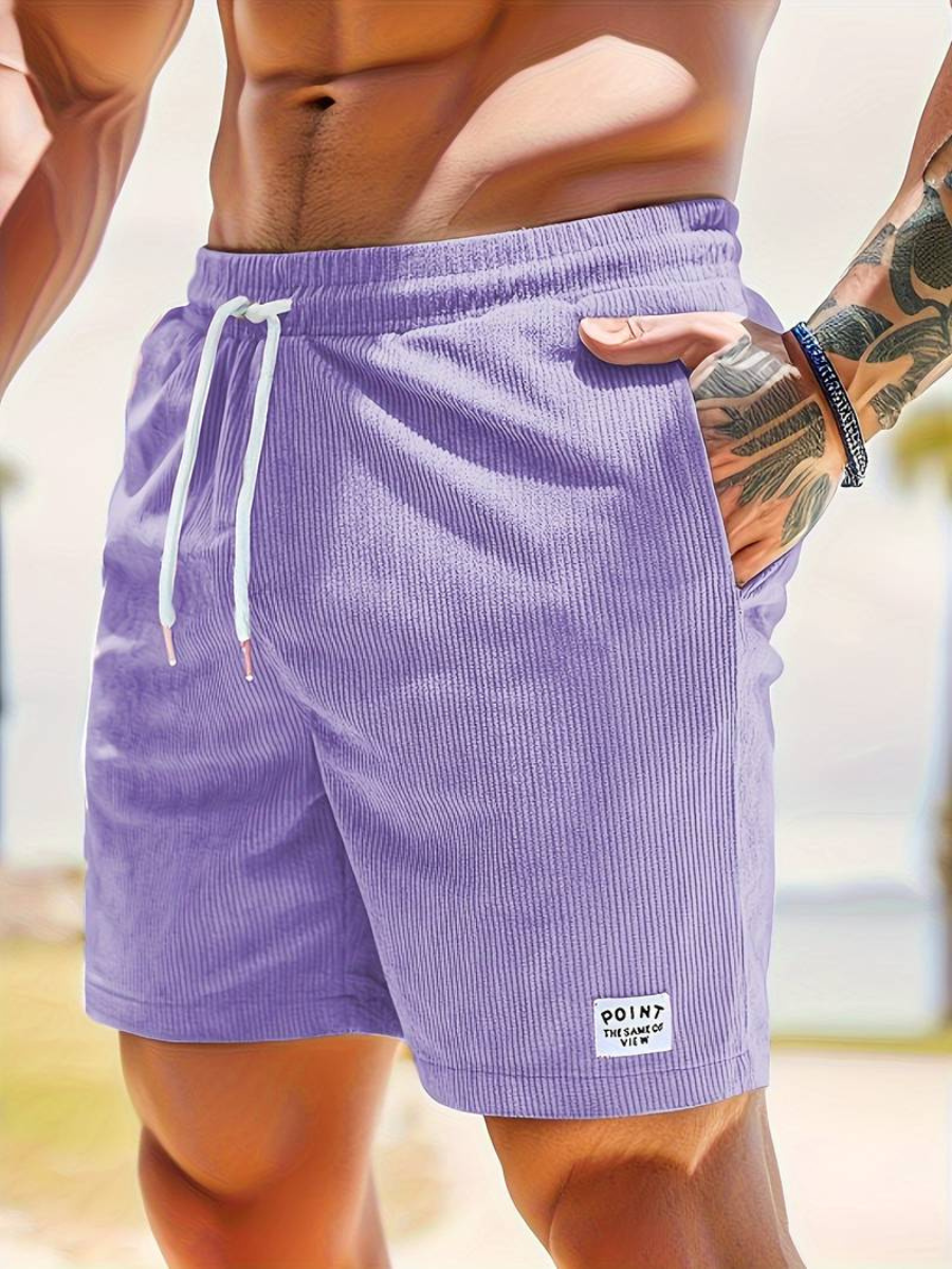 Side view of men's stylish swim shorts, showcasing quick-dry fabric.