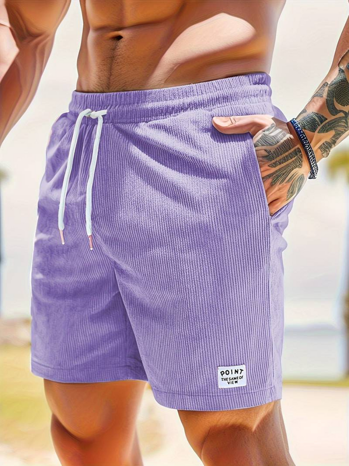 Side view of men's stylish swim shorts, showcasing quick-dry fabric.