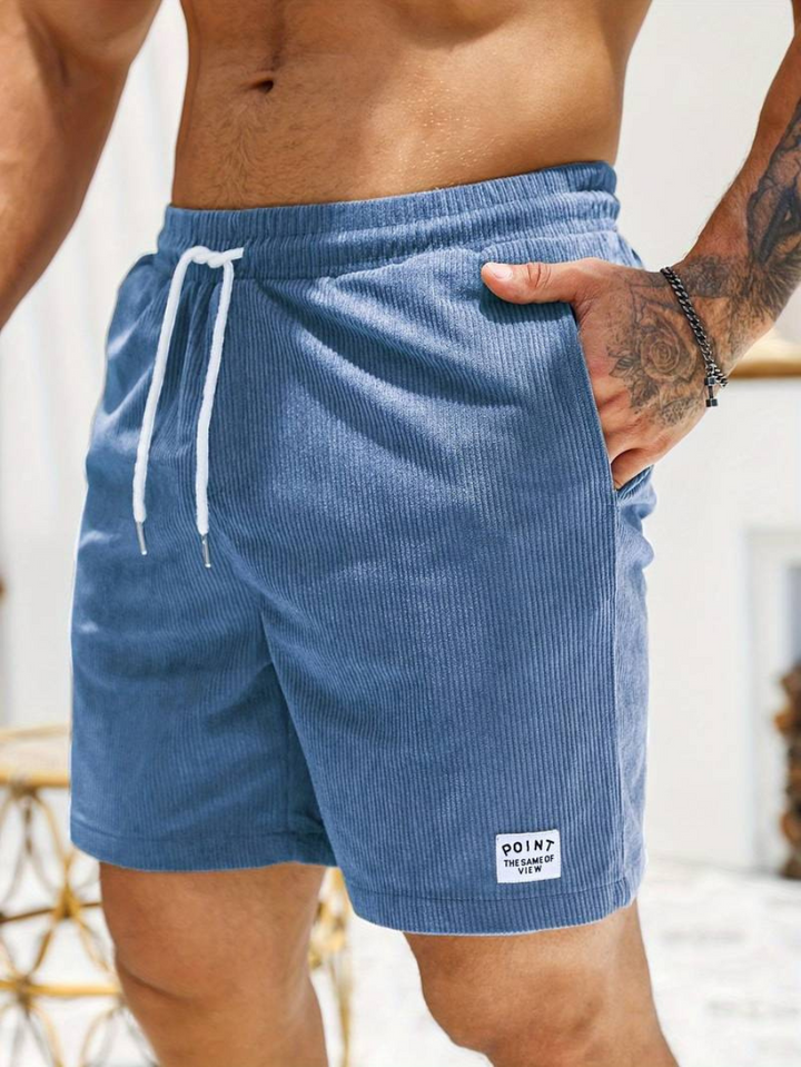 A man enjoying the summer in comfortable and stylish beachwear shorts.