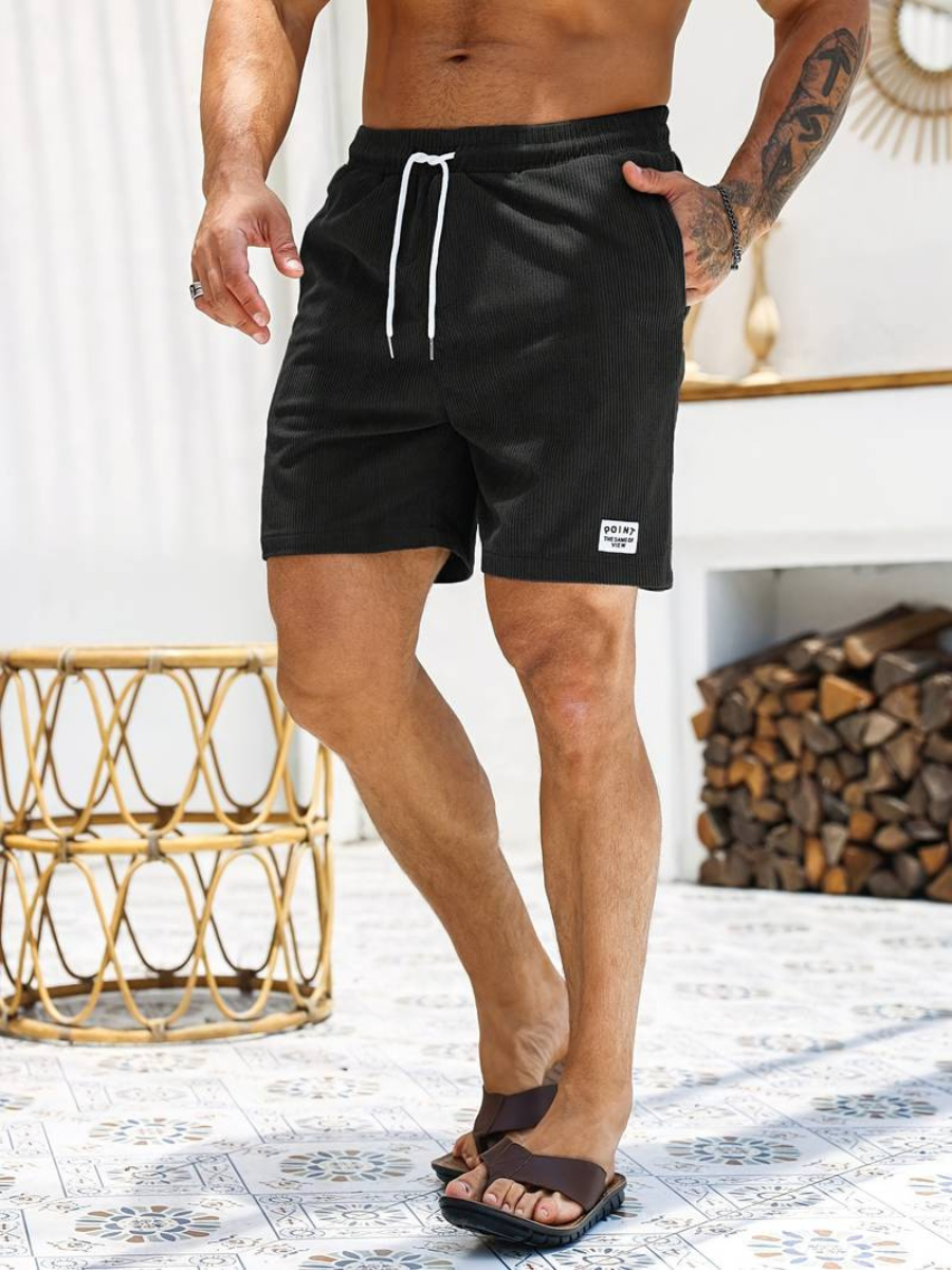 Men's patterned swim shorts, a versatile choice for poolside relaxation.