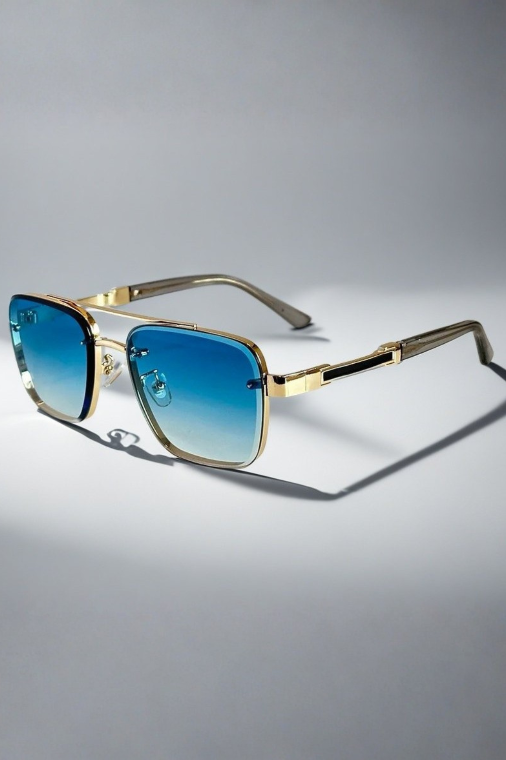 Men's aviator square sunglasses. Gold metal frame, gradient lenses. Stylish casual accessory for eye protection.