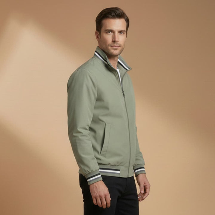 Close-up of a men's lightweight bomber jacket showing ribbed sleeves and a stand collar.