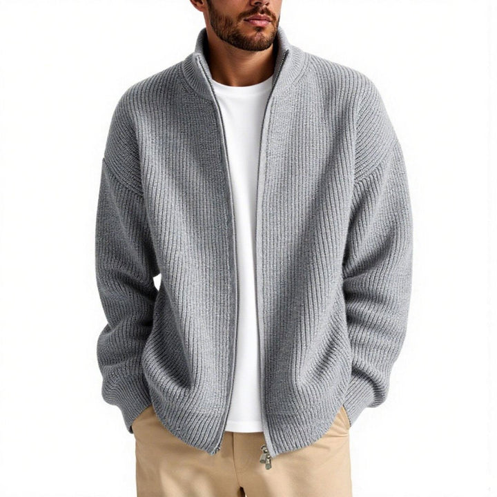 Sleek black men's knitted high collar zipper jacket, a stylish and warm addition to modern men's winter fashion.