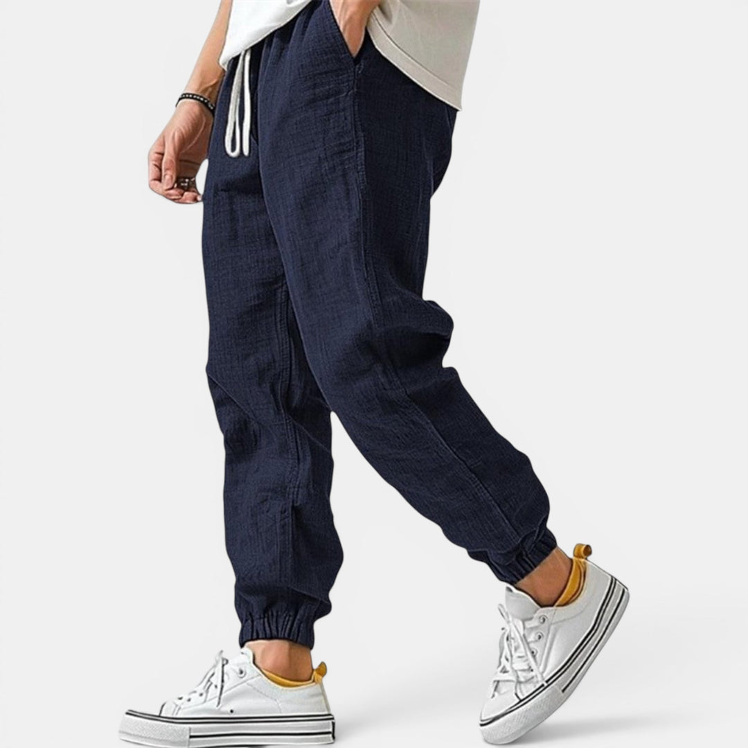 Premium men's breathable pants, designed with a drawstring for a relaxed, tapered fit.